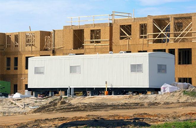 crane lifting modular building for construction office rentals in Beavercreek